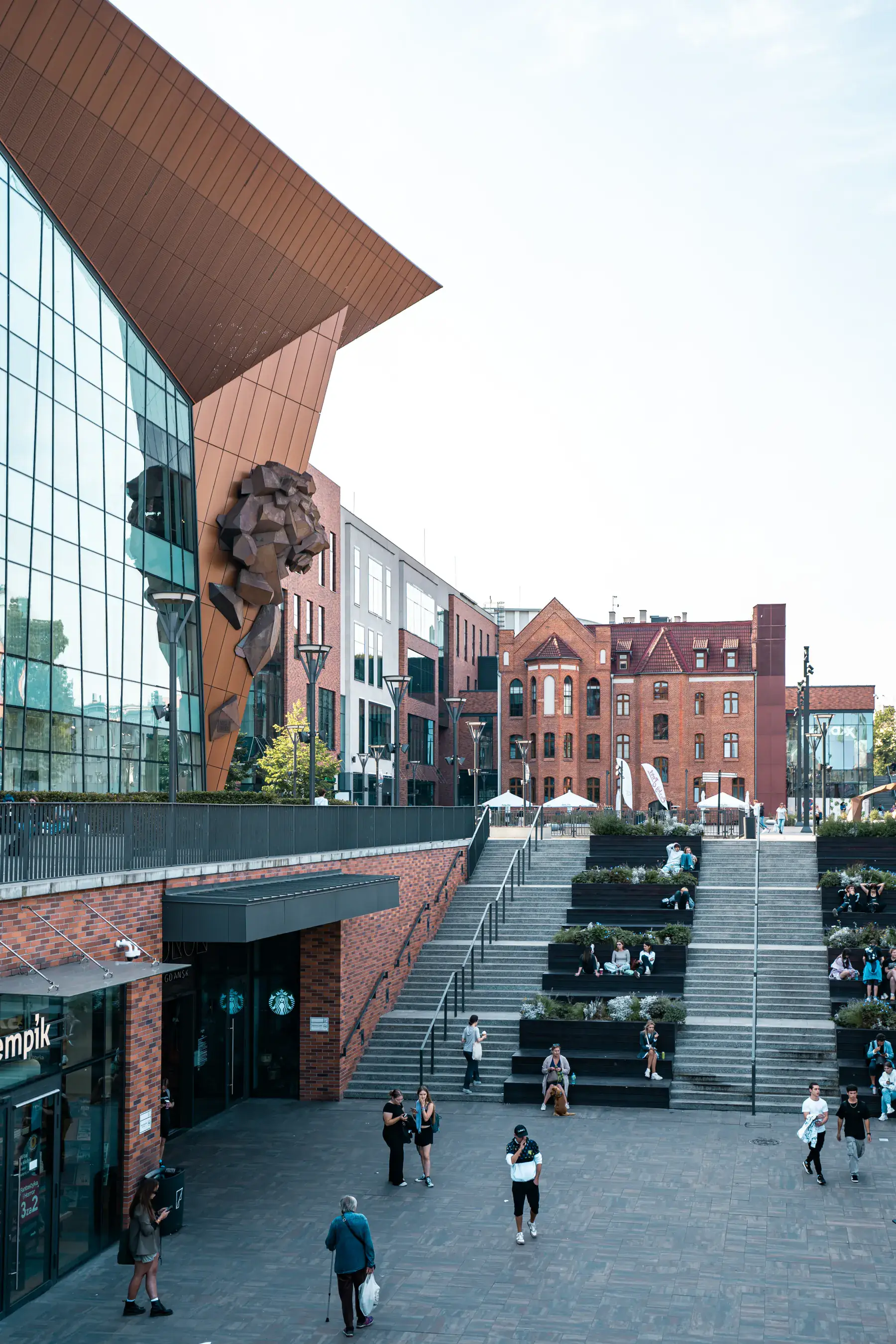 People gathering in a contemporary mixed-use public realm